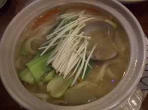 clay pot with soup and udon