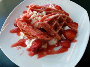 Strawberry waffles with whipped cream