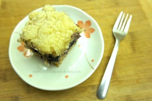 blueberry crumb cake on plate with fork