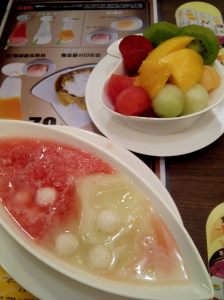 glutinous rice balls with a side of fruit