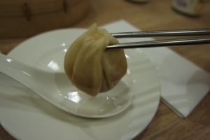 soup dumplings with chopsticks